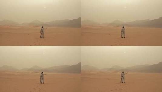 情侣在沙漠中欣赏风景高清在线视频素材下载