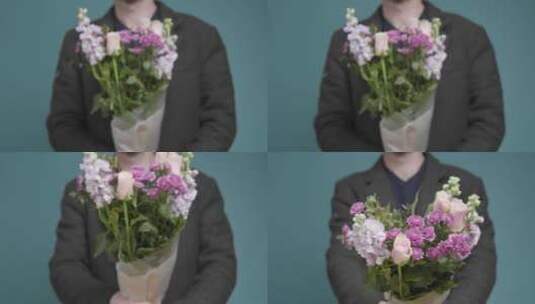 一个男人拿花的中间镜头高清在线视频素材下载