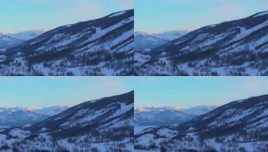 新疆阿勒泰冬季喀纳斯湖雪山水墨画雪景日出高清在线视频素材下载