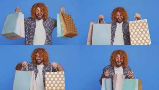 高加索男子展示购物袋广告折扣微笑着用低价高清在线视频素材下载