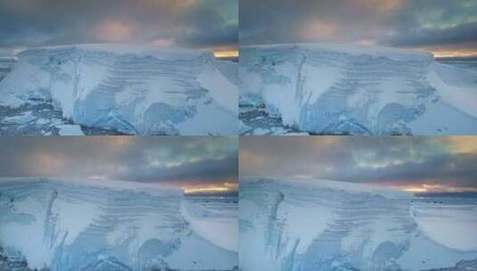 日落天空下的南极洲巨型蓝色冰川高清在线视频素材下载