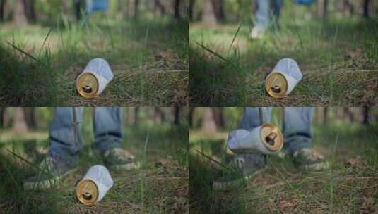一个拿着塑料袋的人用棍子刺穿森林里的垃圾高清在线视频素材下载