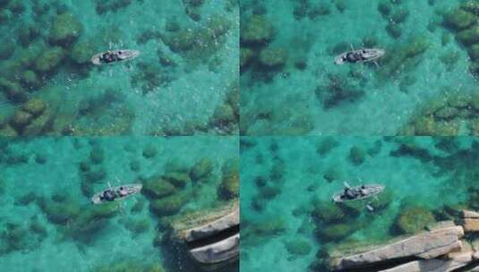 太浩湖冒险中原始蓝色泻湖中的空中情侣皮划高清在线视频素材下载
