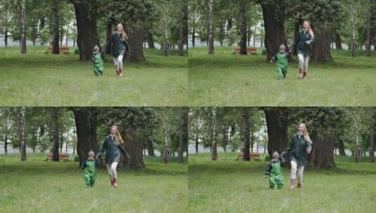 母亲带着孩子在公园奔跑高清在线视频素材下载