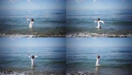 女人站在浅水区跳舞高清在线视频素材下载