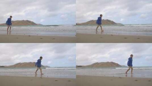 在沙滩上漫步的男孩高清在线视频素材下载