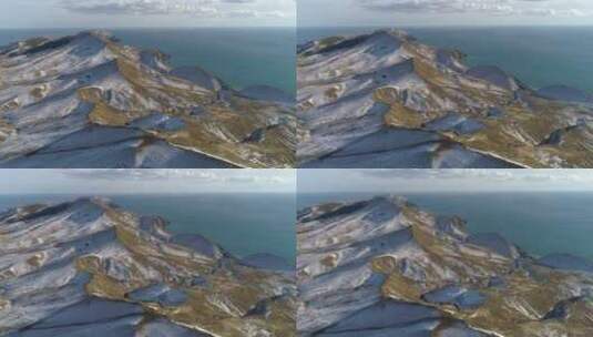 白雪覆盖着海边的小山高清在线视频素材下载