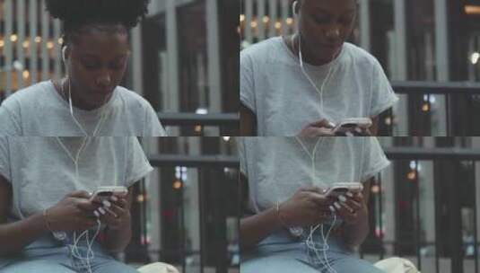 黑人女孩在街头听音乐高清在线视频素材下载