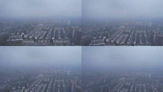 大雾雾霾城市建筑高楼建筑居民楼车流上升高清在线视频素材下载