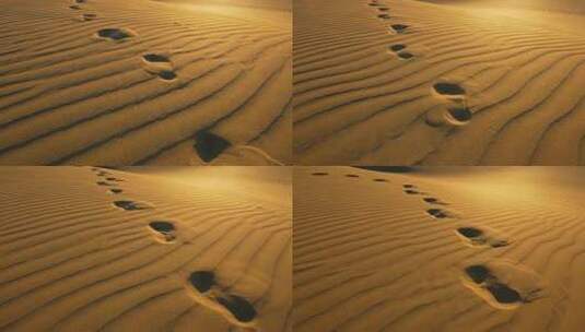 航拍沙漠中沙丘上的脚印高清在线视频素材下载