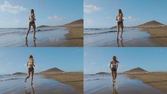 运动女性沿着沙滩跑步高清在线视频素材下载