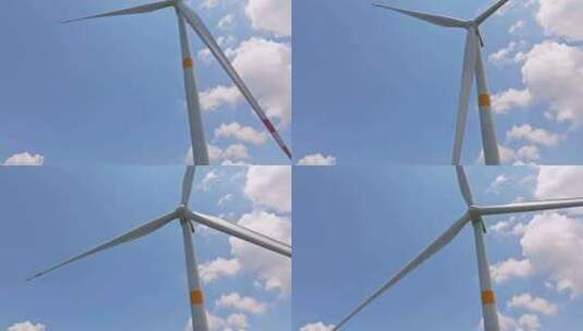 航拍蓝天白云下的风力发电机高清在线视频素材下载