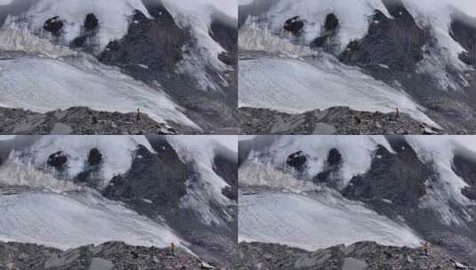 航拍攀登四川横断山脉乌库楚雪山的登山者高清在线视频素材下载