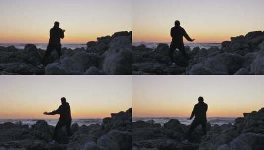 清晨海边岩石上打太极的男人高清在线视频素材下载