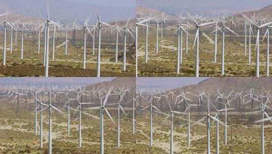 风力涡轮机在沙漠中的田野中旋转高清在线视频素材下载