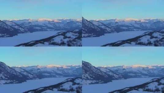 新疆阿勒泰冬季喀纳斯湖雪山水墨画雪景日出高清在线视频素材下载