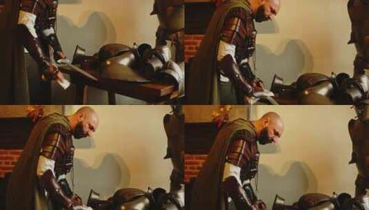 在中世纪的军械库里，强壮的骑士正在清洗他高清在线视频素材下载