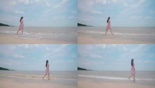 美女在海边漫步游玩遥望远方海水冲刷白沙滩高清在线视频素材下载
