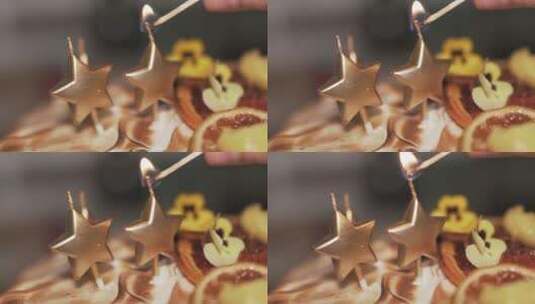 用火柴棒点燃星星形状的蜡烛高清在线视频素材下载