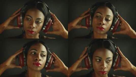 女子用耳机听音乐高清在线视频素材下载