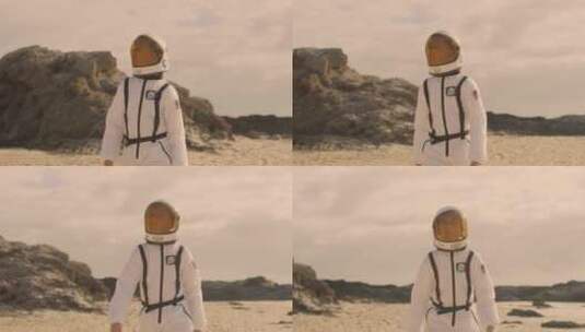 男孩穿着宇航服在沙滩行走高清在线视频素材下载