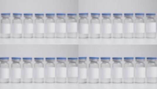 一排贴有白色标签的半透明液体瓶的特写高清在线视频素材下载
