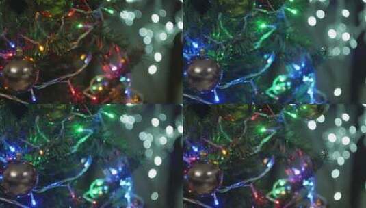 圣诞节往圣诞树上挂装饰品高清在线视频素材下载