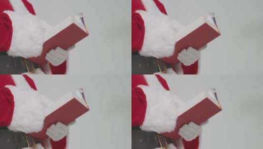 圣诞老人手握红书的特写高清在线视频素材下载