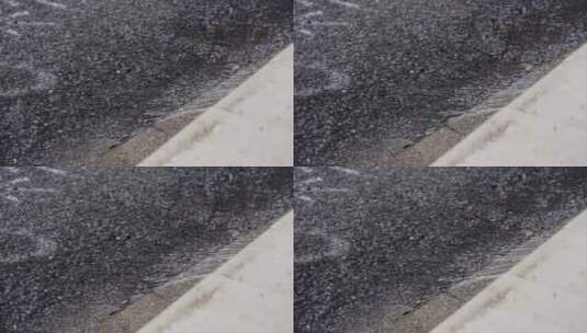 大雨 中的 雨水汇成 流水 街道4K高清在线视频素材下载