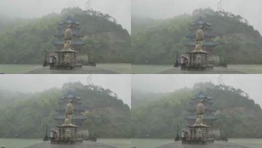 大雨下的浙江桐庐富春江严子陵钓台雕像高清在线视频素材下载