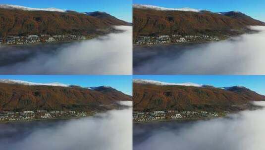 航拍云雾下的靠山乡镇高清在线视频素材下载