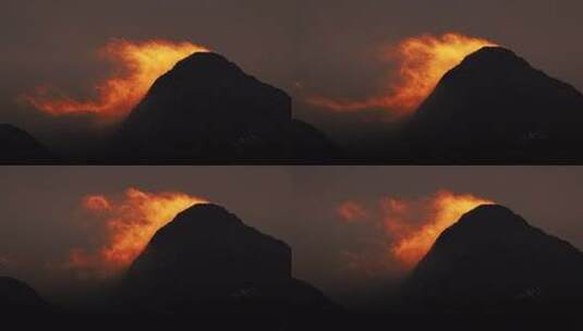 夕阳下山脉山峰云雾飘动逆光剪影高清在线视频素材下载
