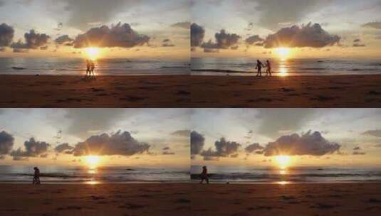日落夕阳、情侣走在海边高清在线视频素材下载