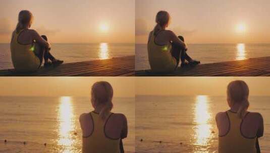 海边日落下的女孩剪影高清在线视频素材下载