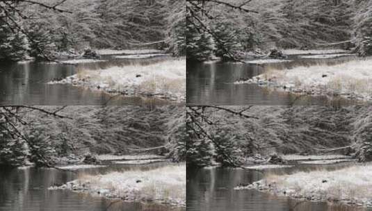 冬天雪花飘飞掉落在小溪里高清在线视频素材下载