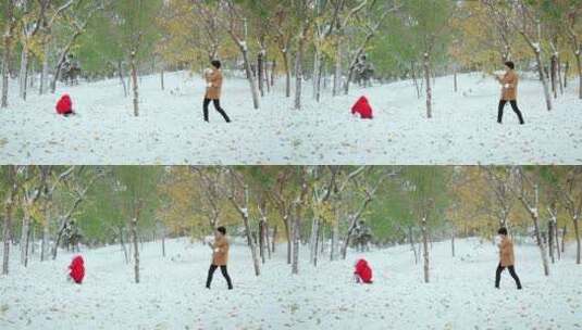 在公园里打雪仗的一对中国母女高清在线视频素材下载
