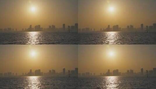日落夕阳逆光拍摄海滨城市高清在线视频素材下载