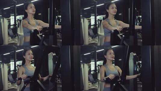 穿运动内衣在健身房锻炼的年轻女性高清在线视频素材下载