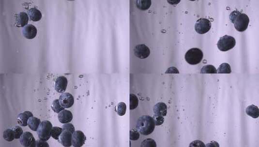蓝莓掉进白色背景的水中高清在线视频素材下载