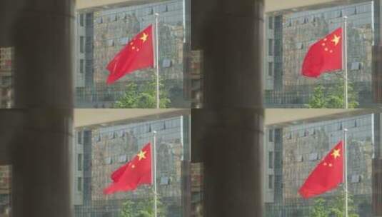 办公楼外的五星红旗飘扬高清在线视频素材下载