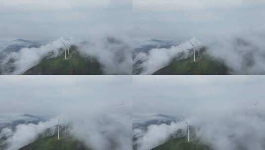 山顶风能发电风车和环绕的云海航拍高清在线视频素材下载