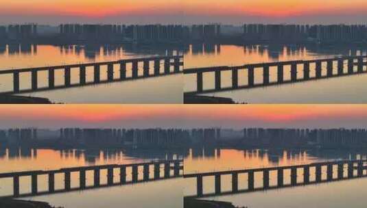 日落黄昏高铁驶过跨江大桥高清在线视频素材下载