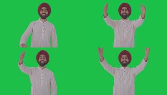 快乐的锡克教印度人给飞吻绿屏高清在线视频素材下载