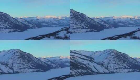 新疆阿勒泰冬季喀纳斯湖雪山水墨画雪景日出高清在线视频素材下载