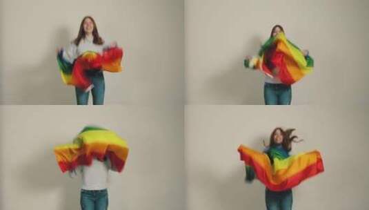 女孩用彩虹和平旗庆祝高清在线视频素材下载