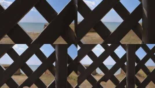 从栅栏看海滩景观高清在线视频素材下载