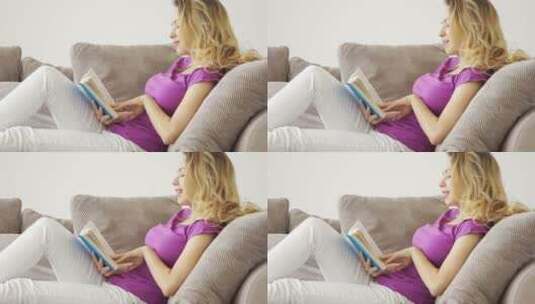 女人躺在沙发上看书高清在线视频素材下载