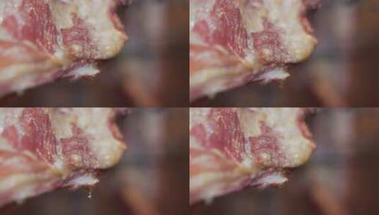 羊腿在烤炉里油从羊腿上滴下来的特写高清在线视频素材下载