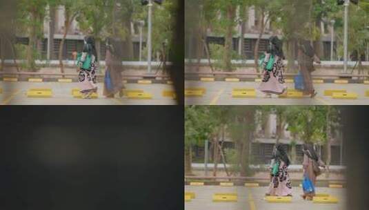 停车场行走的女性镜头高清在线视频素材下载