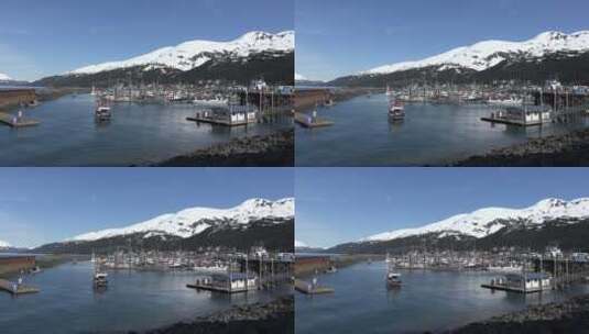 雪山脚下的河流和港口景观高清在线视频素材下载